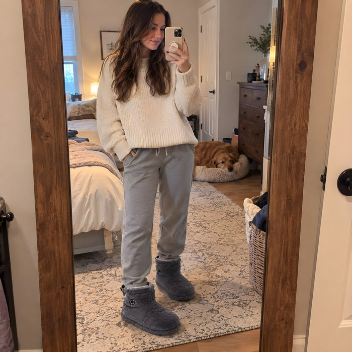 Cliente en bottes chauffantes La Nocte, photo prise dans le miroir de sa chambre